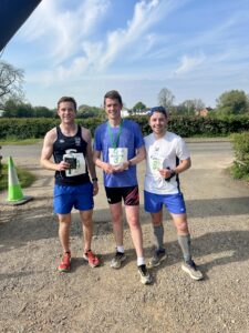 Men's 10k podium: Nate Cooke, winner Andrew Morris and Duncan Leese